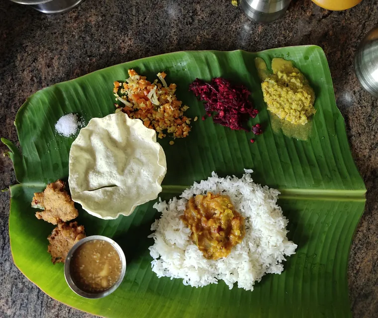 A traditional Tamil meal served on a banana leaf